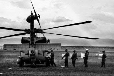 Helicopter personnel load up a US Seahawk helicopter with relief supplies at Tacloban airport. The supplies are intended for remote communities affected by Typhoon Haiyan. Typhoon Haiyan, or Typhoon Y...