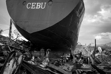 People have made their temporary home beneath a ship which has been washed ashore by Typhoon Haiyan. Typhoon Haiyan, or Typhoon Yolanda as it is known in the Philippines, was the deadliest typhoon to...