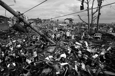 Hundreds of people clear the debris blocking streets in Tacloban under a food-for-work programme. Typhoon Haiyan, or Typhoon Yolanda as it is known in the Philippines, was the deadliest typhoon to hit...
