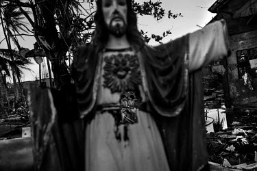 A damaged life-size Statue of Jesus Christ sits in the middle of debris on a Tacloban street. Typhoon Haiyan, or Typhoon Yolanda as it is known in the Philippines, was the deadliest typhoon to hit the...