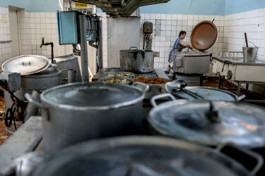 A woman works in the kitchen of the Chernomorets (Black Sea) Hotel.