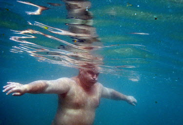 A man swims in the Black Sea near Pitsunda.
