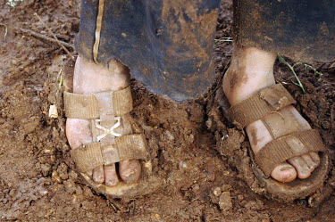 The muddy feet and sandals of a young boy in a refugee camp for Syrian refugees in the Bekaa (Beqaa) Valley in Lebanon. Since the beginning of the civil war in Syria, some 880,000 Syrians have fled to...