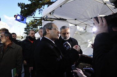 Syrian government Deputy Minister of Foreign Affairs Faisal Mekdad talks to Syrian State TV in the park of the Palais des Nations with the Minister of Information Omran al-Zoubi next to him. The Genev...
