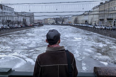 Dmitry Musolin Ph.D. looks over the icy Neva River. He is a gay activist and Associate Professor of the Department of Forest Protection and Game Management & Director of the Department of Advanced Tra...