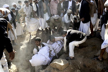 Protestors buried the body of a protestor on 19 October 2011 during a funeral for 12 protestors killed by by pro-President Saleh troops during recent anti-government protests. The 33 year rule of auth...