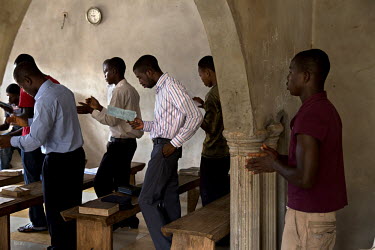 Sarh Manseray (right) during a religious service. He is now working in a reintegration  program run by Free Minor Africa. He was arrested at the age of 13 and accused of murder in 2007. One of his fri...