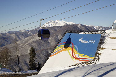 A ski gondola goes through test run on Krasnaya Polyarna mountain, the venue for the Alpine events for the 2014 Winter Olympic Games.