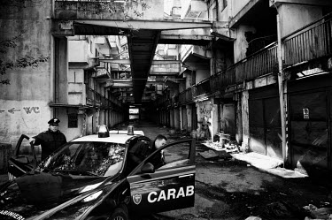 Two carabinieri (military police) officers patrol inside 'Le Vele di Scampia (The Sails of Scampia), a notorious housing development built over the 1960s and 70s in Naples' Scampia district. It was bu...