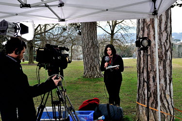 A Syrian state TV journalist speaks live to camera on the lawn of the Palais des Nations on the first day of the second round of the Geneva II talks.  The Geneva II talks which started in Montreux and...