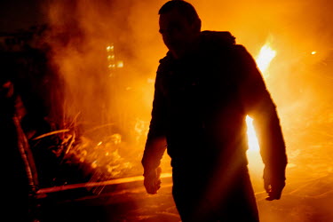 Fires burn an activist in Maidan Nezalezhnosti (Independence Square). Protests against the government of President Viktor Yanukovych were sparked on 21 November 2013 by the Ukrainian government's deci...