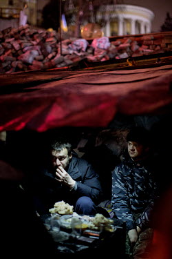 Activists in a bivouac in Maidan Nezalezhnosti (Independence Square) eat some bread. Protests against the government of President Viktor Yanukovych were sparked on 21 November 2013 by the Ukrainian go...