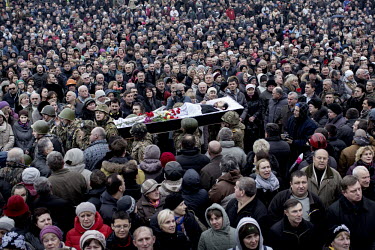 A huge crowd at the funeral of one of the dozens of protesters who died in clashes with police in Kiev on 20 February 2014. Protests against the government of President Viktor Yanukovych were sparked...