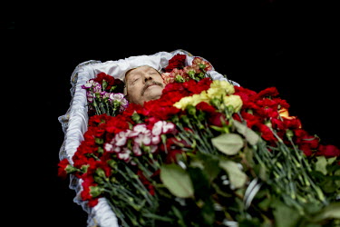 Flowers bedeck the corpse of Kulbitchetsky Volodimir, one of the dozens of protesters who died in clashes with police in Kiev. Protests against the government of President Viktor Yanukovych were spark...