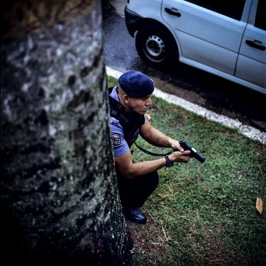 A member of the Unidade de Policia Pacificadora (UPP) at a training facility in South Rio. The UPP is the policing force behind the Pacification Program that aims to make the Favelas of Rio safe and f...