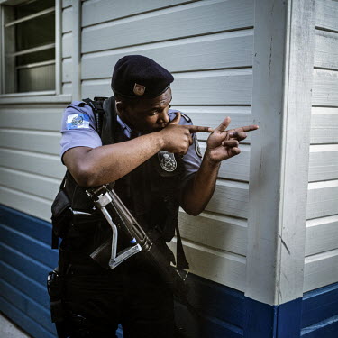 A member of the Unidade de Policia Pacificadora (UPP) at a training facility in South Rio. The UPP is the policing force behind the Pacification Program that aims to make the Favelas of Rio safe and f...