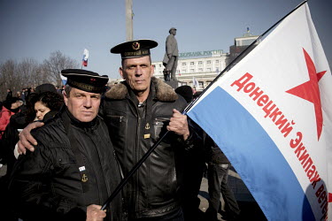 Two Ukranian sailors wearing the naval caps of the former Soviet fleet participate in a pro-Russian rally at Donetsk's Lenin Square. Pro-russian protests in the eastern part of the country have called...