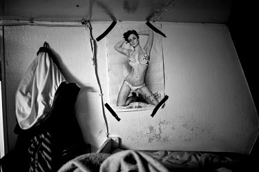 A picture of a model in swimwear on a wall in the crew members quarters on board the Seneca, a commercial swordfish trawler. There are conflicting arguments as to the health of the North Atlantic Broa...