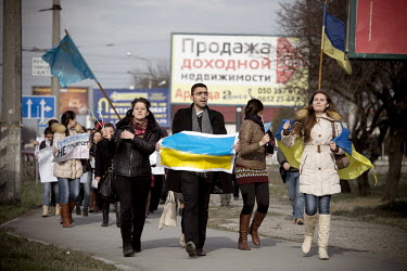 Tatar people wave Ukranian flags at a rally against the 16 March referendum which saw 95% of the voters decide to join with the Russian federation according to local officials.   Tatars have lived in...