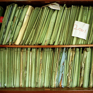 Paper records line a shelf in the office of the investigator at the Anti-Corruption Commission Headquarters.