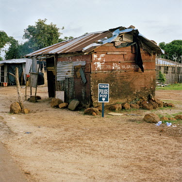 The police post in Tokeh. On its wall a notice reads: 'The penalty for urinating here is Le5000'.