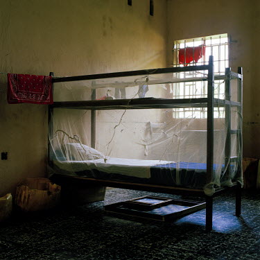 A mosquito net covers an inmate's bed at a remand home for juveniles awaiting trail or sentencing.
