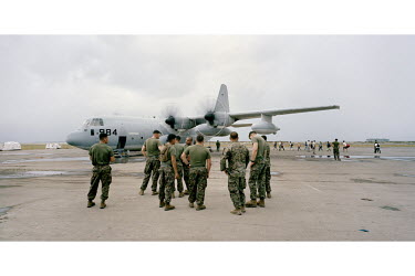US Marines, near a transport plane, help with the relief effort at Tacloban airport. Typhoon Haiyan, or Yolanda as it is known in the Philippines, made landfall on 8 November 2013 and was one of the d...