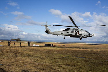 Helicopters, carrying aid, take off to deliver it to remote parts of Leyte Island. Typhoon Haiyan, or Yolanda as it is known in the Philippines, made landfall on 8 November 2013 and was one of the dea...