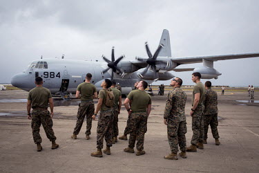 US Marines, near a transport plane, help with the relief effort at Tacloban Airport. Typhoon Haiyan, or Yolanda as it is known in the Philippines, made landfall on 8 November 2013 and was one of the d...