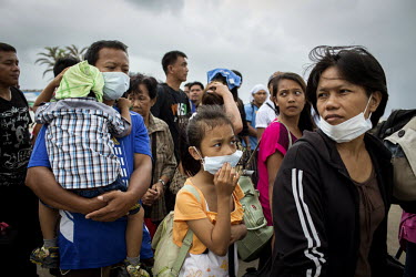 People displaced by Typhoon Haiyan wait, at Tacloban Airport,  to get on a US military flight to Manila. Typhoon Haiyan, or Yolanda as it is known in the Philippines, made landfall on 8 November 2013...