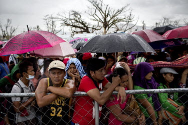 People displaced by Typhoon Haiyan wait, at Tacloban Airport,  to get on a US military flight to Manila. Typhoon Haiyan, or Yolanda as it is known in the Philippines, made landfall on 8 November 2013...