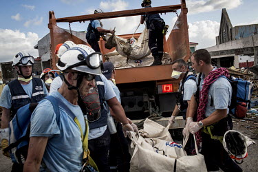 Emergency workers collect bodies in Tacloban city after Typhoon Haiyan swept through the Philippines. Typhoon Haiyan, or Yolanda as it is known in the Philippines, made landfall on 8 November 2013 and...