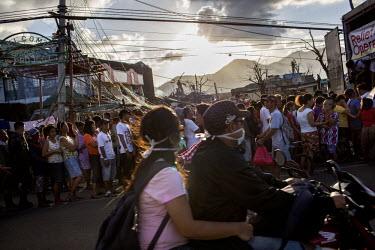 People queue at an aid distribution point in Tacloban city after Typhoon Haiyan swept through the Philippines. Typhoon Haiyan, or Yolanda as it is known in the Philippines, made landfall on 8 November...