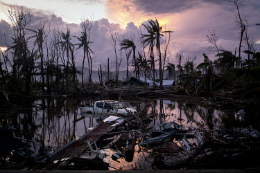 A vehicle is half submerged in a scene of mass devastation on Leyte Island after Typhoon Haiyan swept through the Philippines. Typhoon Haiyan, or Yolanda as it is known in the Philippines, made landfa...