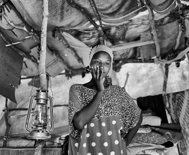 A woman inside her dwelling at the Kharaz refugee camp. The camp holds roughly 15,000 mostly Somali migrants, half of whom are children. The United Nations Refugee Agency (UNHCR) has raised concerns o...