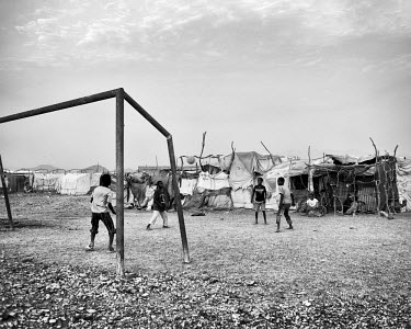 Children playing football in Kharaz refugee camp. The camp holds roughly 15,000 mostly Somali migrants, half of whom are children. The United Nations Refugee Agency (UNHCR) has raised concerns over th...