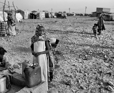 A young girl collects water from a well in Kharaz refugee camp. The camp holds roughly 15,000 mostly Somali migrants, half of whom are children. The United Nations Refugee Agency (UNHCR) has raised co...