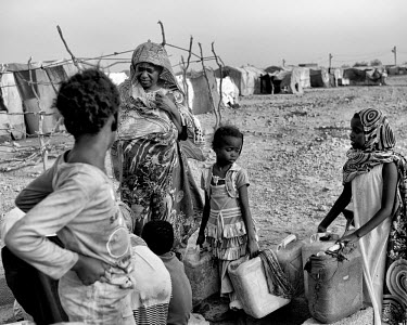 Women and children collecting water from a well in Kharaz refugee camp. The camp holds roughly 15,000 mostly Somali migrants, half of whom are children. The United Nations Refugee Agency (UNHCR) has r...