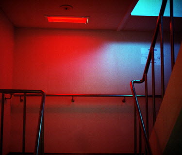 A red light illuminates a stairwell on the Mary Maersk container ship. The Mary Maersk is one of 20 identical Triple E Class cargo ships ordered by the Danish shipping company Maersk. Weighing in at 5...