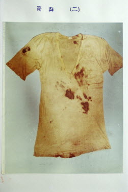 The front of a blood stained t-shirt. It formed part of the evidence against Iwao Hakamada. It was found inside a miso tank at the factory where he worked. Courtesy by Shimizu Shizuoka citizen group s...