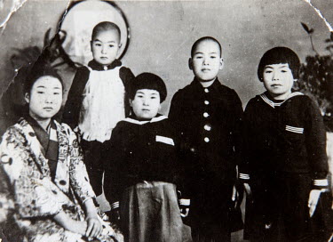 A copy of a photo of the Hakamada family. From left to right: mother Tomo, Iwao, elder sister Hideko. Courtesy of Hideko Hakamada. Iwao Hakamada (b. 1936) was arrested in August 1966 at the age of 30...