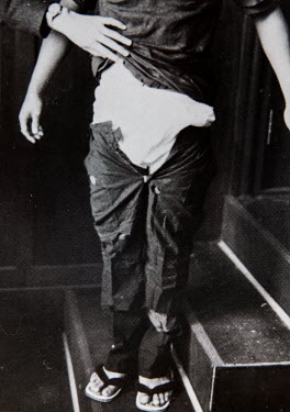 A copy of a photo showing Iwao Hakamada trying on a pair of trouser found in a miso tank which was used as a piece of evidence in his prosecution (undated). Courtesy of Hideko Hakamada, Iwao's sister....