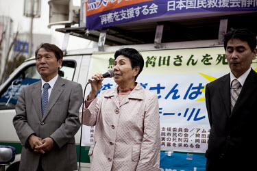Hideko Hakamada, 80, elder sister of Iwao Hakamada, center, makes a speech at her brother's birthday street appeal in Tokyo.  Iwao Hakamada (b. 1936) was arrested in August 1966 at the age of 30 for t...
