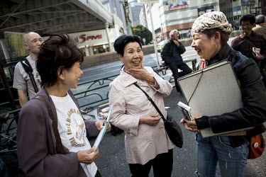 Hideko Hakamada, 80, elder sister of Iwao Hakamada, chats with supporters of Iwao, at her brother's birthday street appeal in Tokyo. Iwao Hakamada (b. 1936) was arrested in August 1966 at the age of 3...