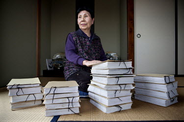 Hideko Hakamada, 80, elder sister of Iwao Hakamada, sits with piles of letters from Iwao at home in Hamamatsu city. Iwao Hakamada (b. 1936) was arrested in August 1966 at the age of 30 for the murder...