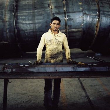 An Egyptian migrant worker in a steel fabrication factory.