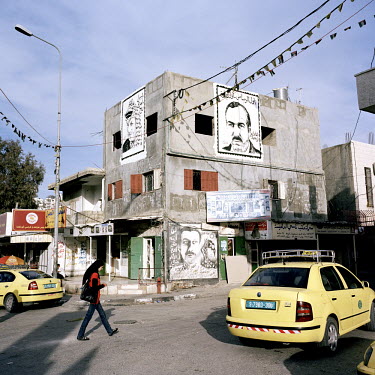 A mural of Abu Jihad (right), founder of Fateh and commander of its armed wing, al-Assifa. In 1988 he was assassinated, allegedly by Israeli commandos, at his home in Tunis. The mural on the left is Y...