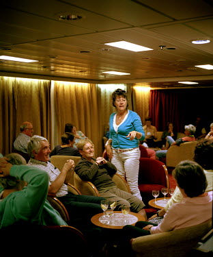 Passengers in the Main Lounge on the RMS St Helena. There are only two remaining Royal Mail Ships, the other being Cunard's Queen Mary 2. The RMS St Helena is the only link to the outside world for th...