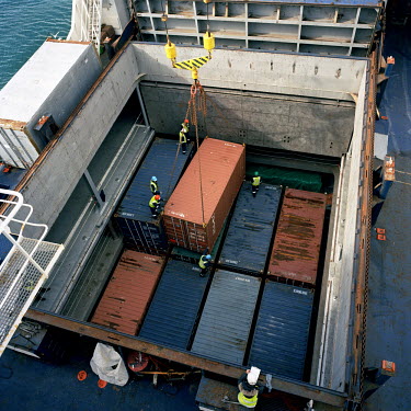 Cargo bound for St Helena is loaded into the hold of the RMS St Helena at Cape Town before setting sale. There are only two remaining Royal Mail Ships, the other being Cunard's Queen Mary 2. The RMS S...
