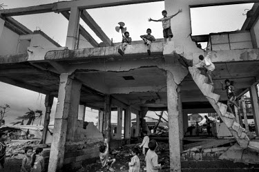 Boys playing in a the remains of a building destroyed during Typhoon Haiyan. Typhoon Haiyan, or Yolanda as it is known in the Philippines, made landfall on 8 November 2013 and was one of the deadliest...